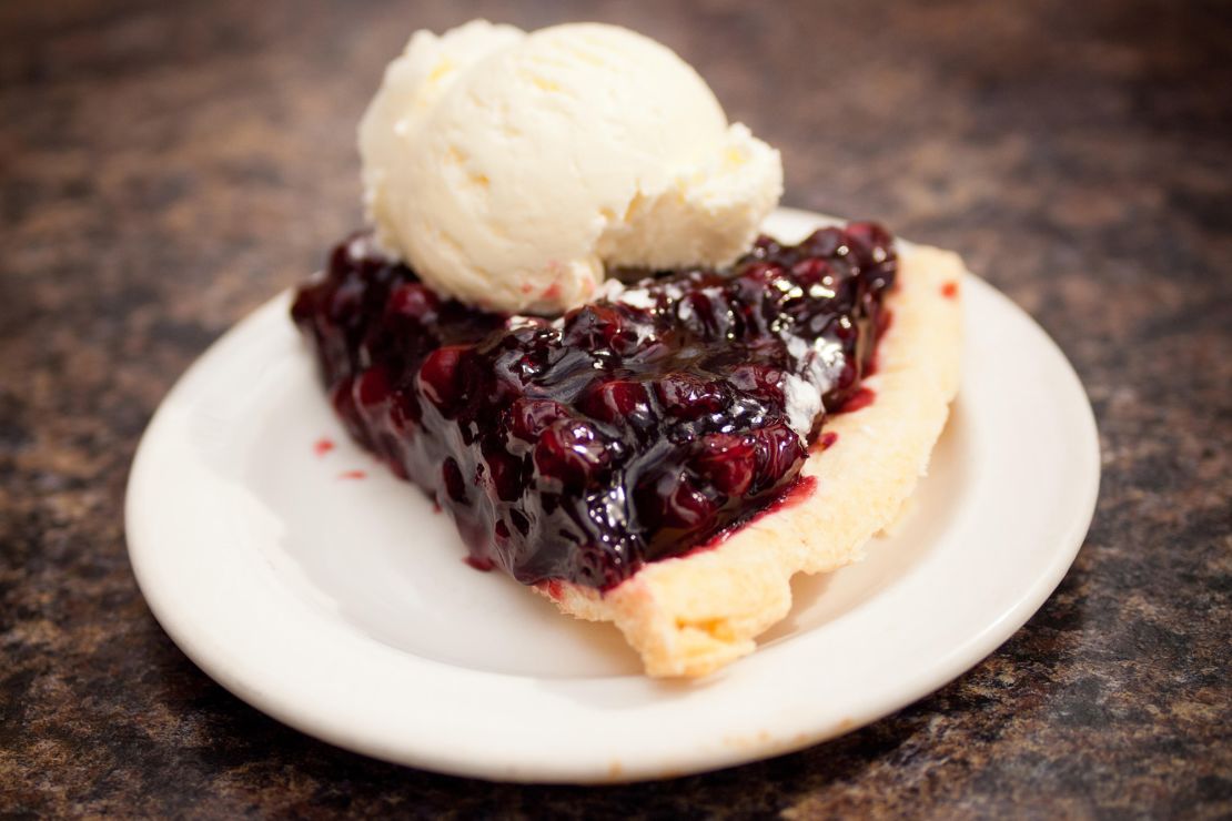 A slice of Saskatoon berry pie and a scoop of vanilla ice cream served at Saskatoon's Berry Barn.