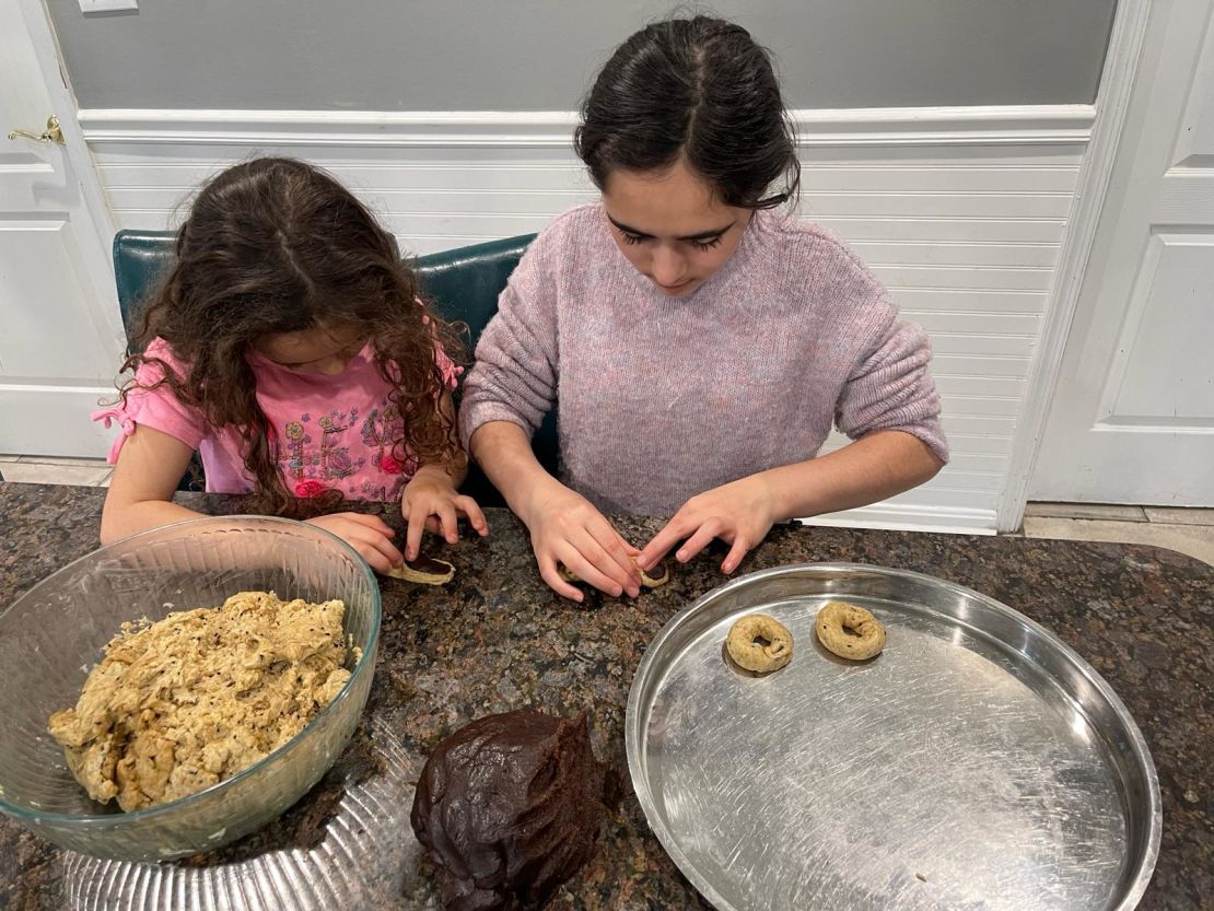 Ahead of Eid, El-Haddad and her daughters prepare ka'ik, traditional ring-shaped cookies stuffed with date paste.