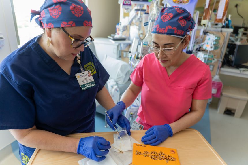 Roxana Reyna, left, and Dr. Vanessa Dimas tried an unusual treatment for Eliana's wound.