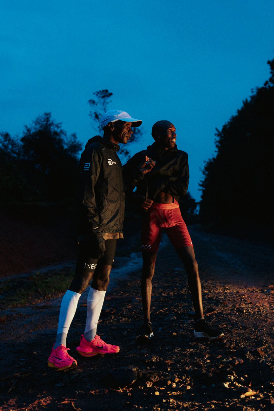 Kipchoge (left) prepares for a pre-dawn run with a member of his training team. The elite group of runners has been preparing for the Paris Olympics at a remote high-altitude camp in Kaptagat, northern Kenya.