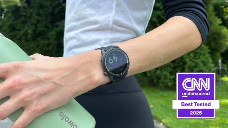 a person wearing a coros pace 3 running watch and holding a green water bottle
