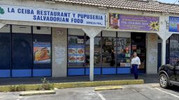 Elizabeth Mendoza, a restaurant owner who helped both protesters and police during the June 7 protests in Los Angeles, stands in front of her restaurant.
