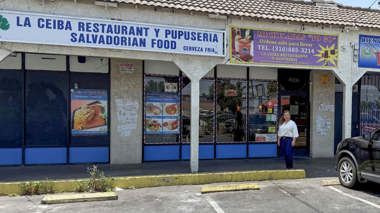 Elizabeth Mendoza, a restaurant owner who helped both protesters and police during the June 7 protests in Los Angeles, stands in front of her restaurant.