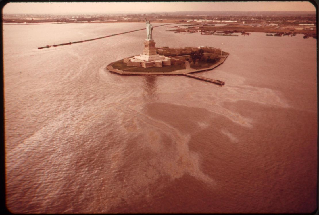 An oil slick surrounds Liberty Island in New York Harbor in May 1973.