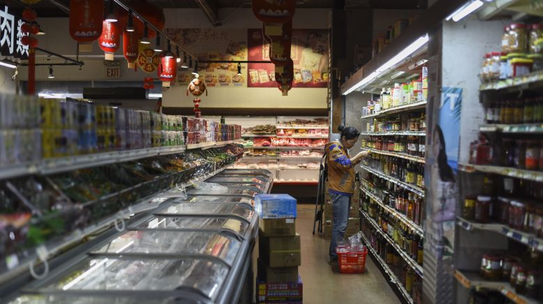 People shop at the Chang Jiang Supermarket in the Flushing neighborhood of New York’s Queens borough on Friday, April 18. Many of the products sold at the store have been affected by high tariffs on Chinese goods set by the Trump administration. (Emmalee Reed/CNN)