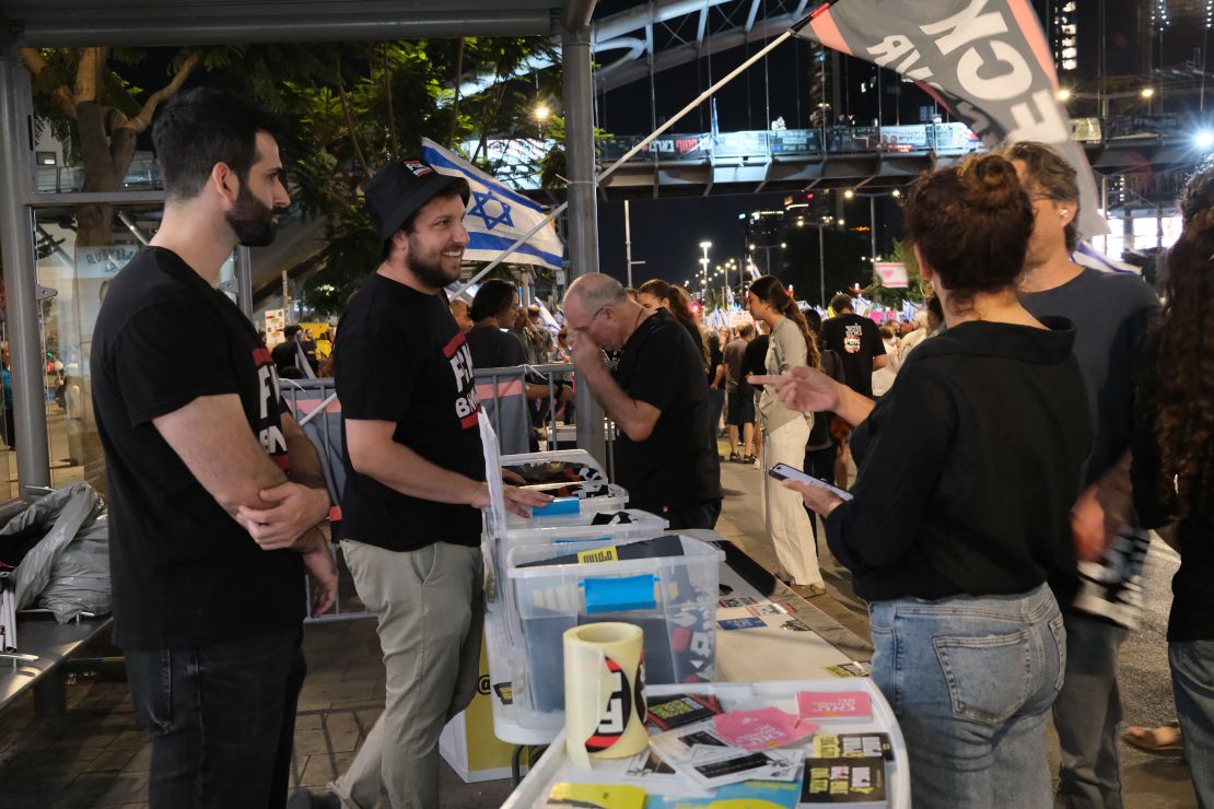 Eran Nissan speaks to fellow protesters at a large anti-government gathering in Tel Aviv on Saturday, October 19, 2024. 