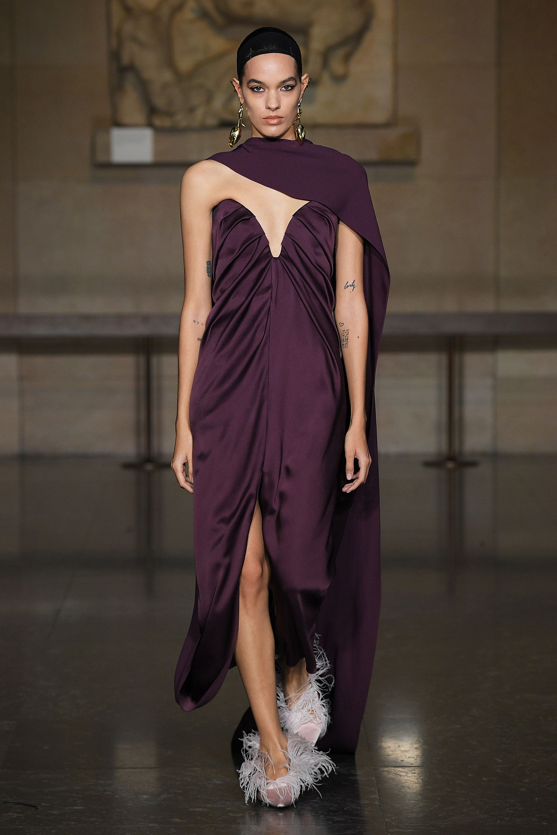 Staged in the British Museum, the Erdem show featured dresses with built-in scarf drapes.