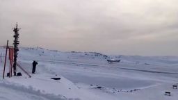 The plane flown by Ethan Guo is seen landing in Antarctica.