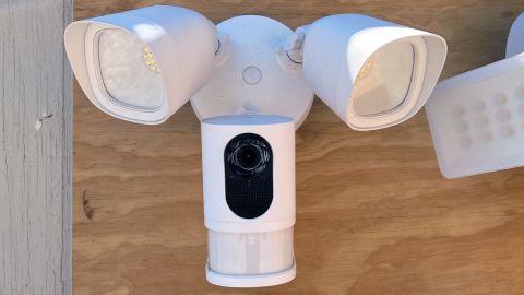 Eufy Floodlight Camera 2K outdoor security camera, mounted on a plywood sheet