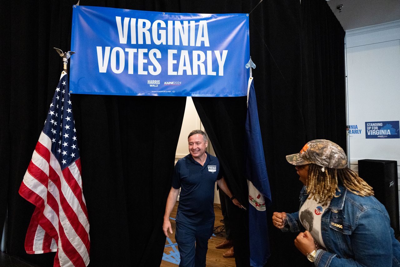 Eugene Vindman walks to the stage to speak during the Virginia Democrats' first day of early voting rally in Manassas, Virginia, on September 20. 