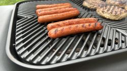 Hot dogs and burgers on Everdure grill