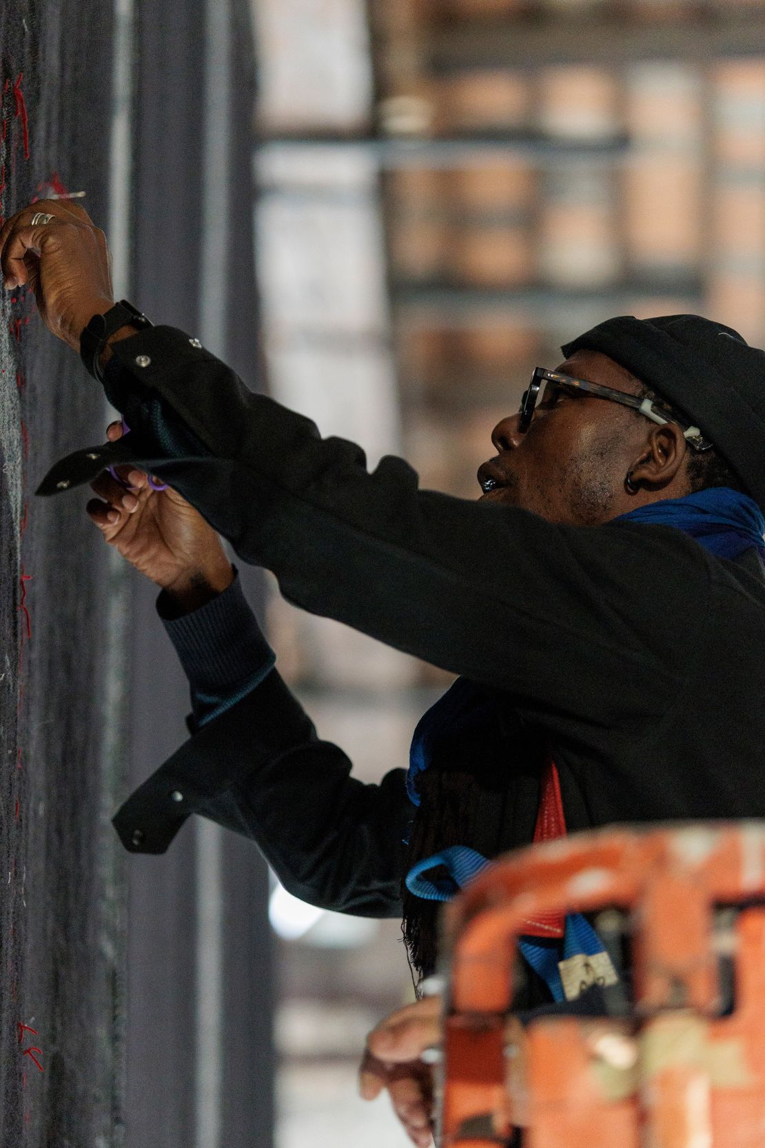 Ishola Akpo sets up his piece titled “Iyalode” at the Benin national pavilion in Venice, Italy.