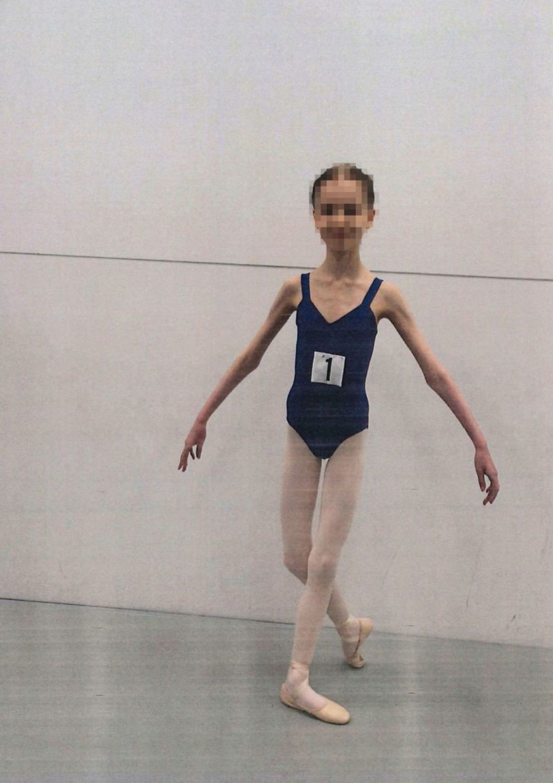 Images tendered to the court show the girl's slight frame as she took part in ballet lessons in Perth, Western Australia. CNN has obscured the girl's face to protect her identity.