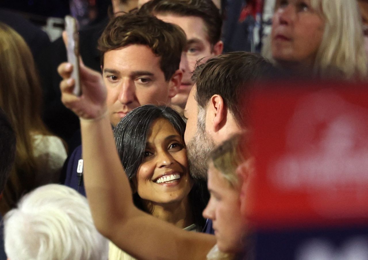 Republican vice presidential candidate JD Vance is accompanied by his wife Usha Chilukuri Vance as he arrives for Day 1 of the Republican National Convention, at the Fiserv Forum in Milwaukee, Wisconsin, on July 15.