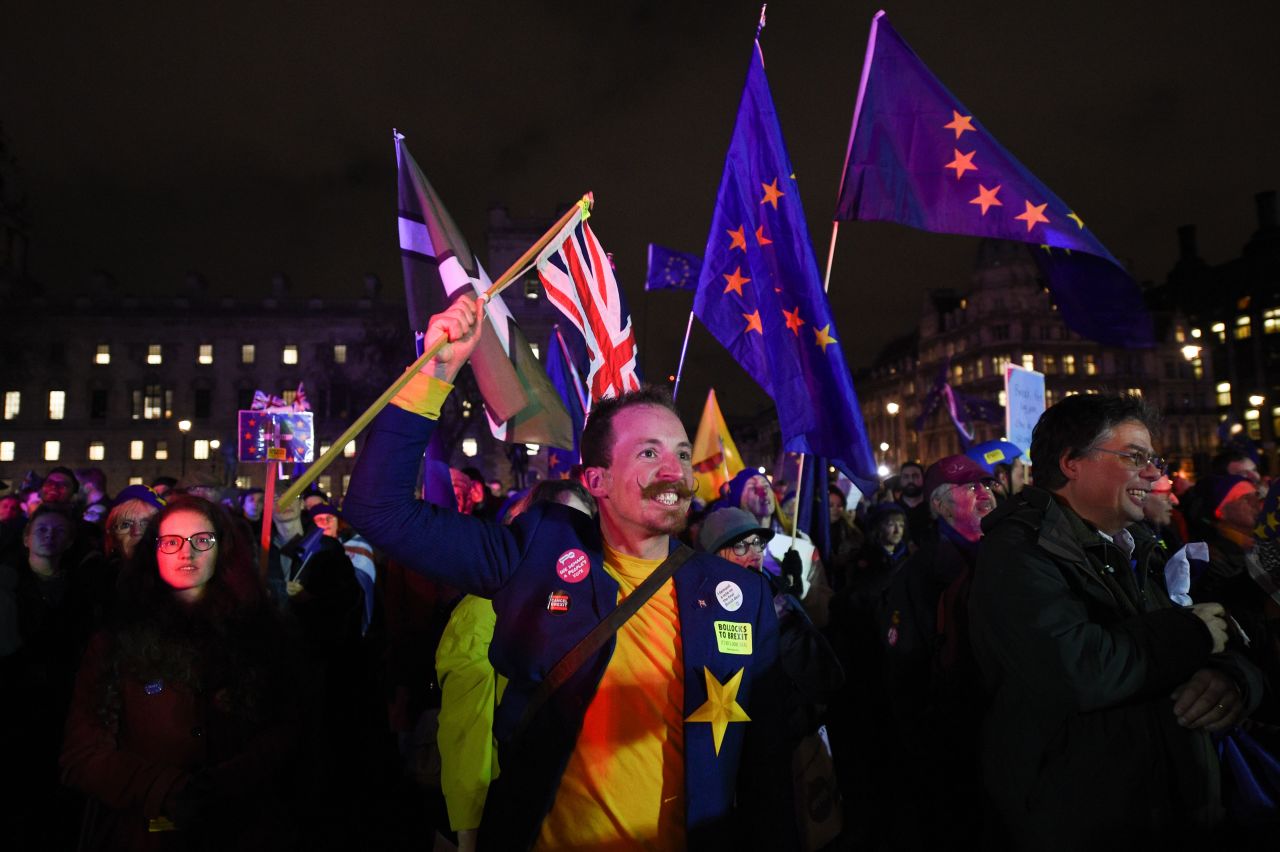 Anti-Brexit supporters celebrate in Parliament Square, central London, following the outcome of the vote.?