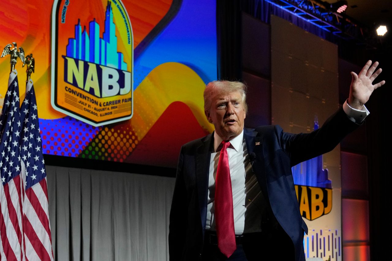 Donald Trump waves as he walks off stage at the National Association of Black Journalists (NABJ) convention at the Hilton Hotel in Chicago, Illinois on July 31.