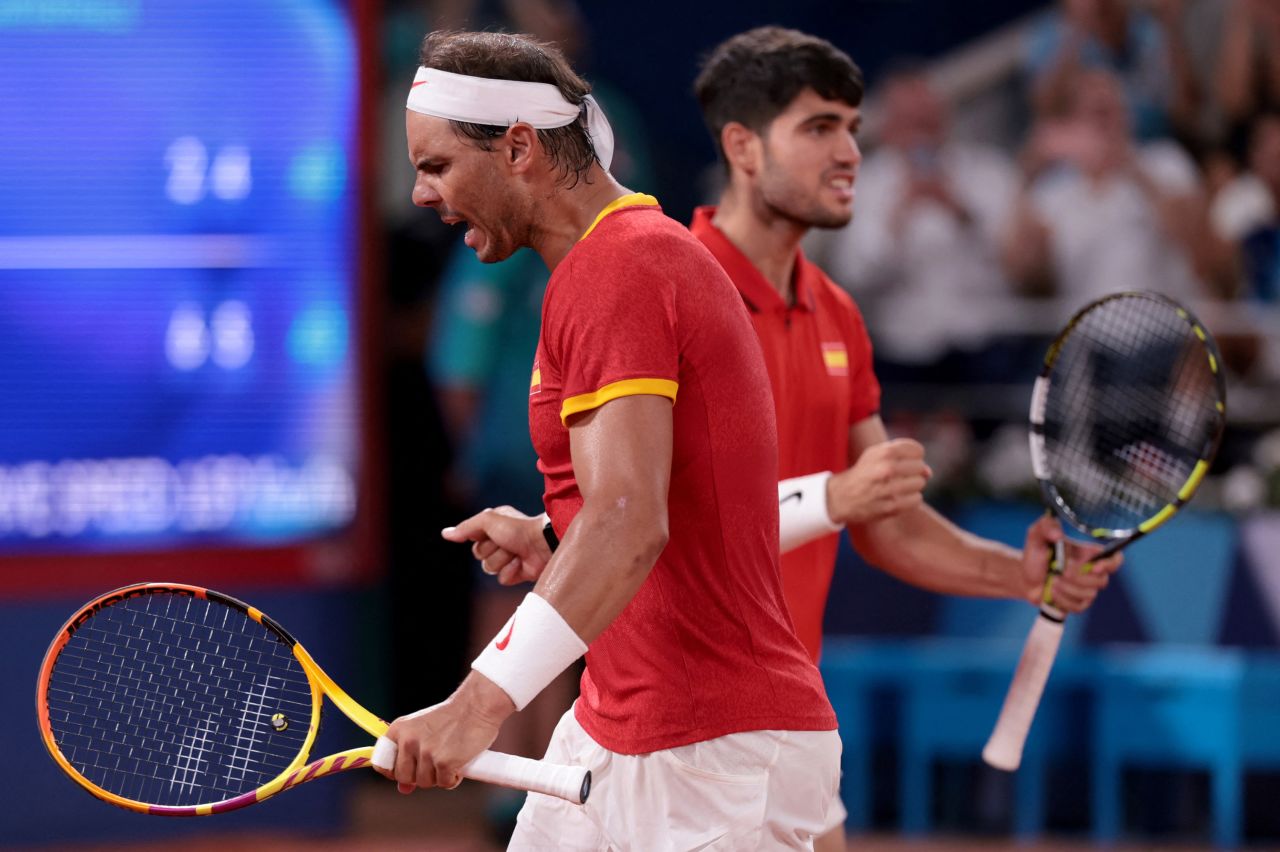 Spain's Carlos Alcaraz and Rafael Nadal react during their Men's Doubles Quarterfinals match against USA's Austin Krajicek and Rajeev Ram on July 31.