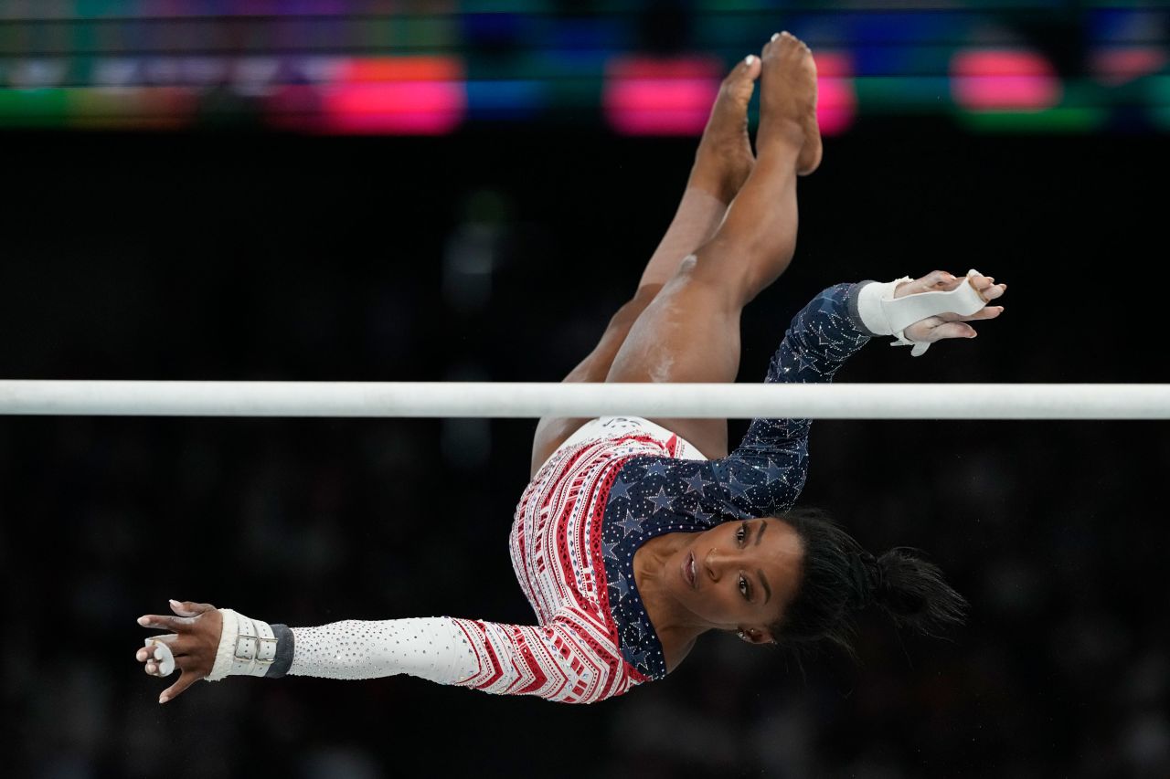 Simone Biles performs on the uneven bars on Tuesday.