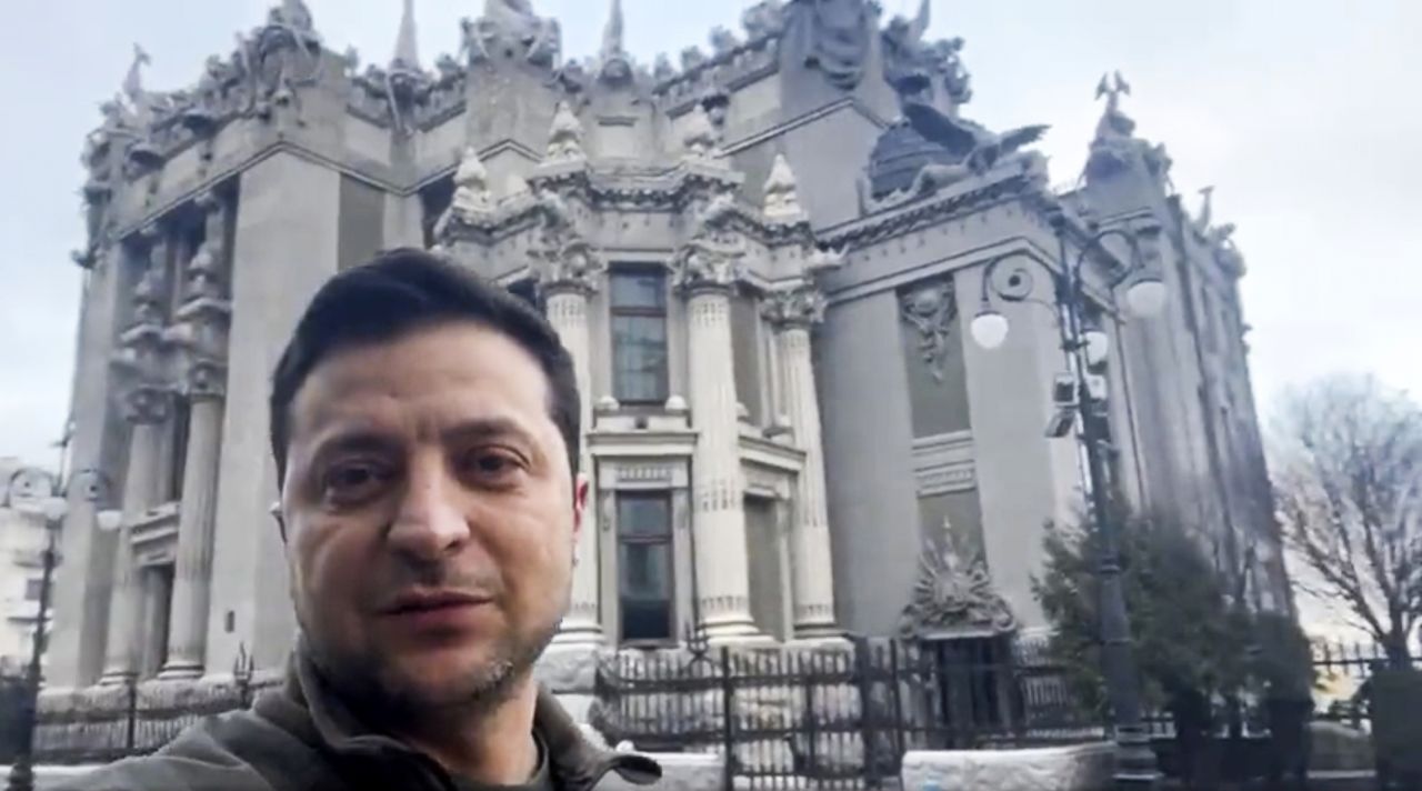 In this photo provided by the Ukrainian Presidential Press Office, Ukrainian President Volodymyr Zelensky speaks to the nation via his smartphone in the center of Kyiv, Ukraine, on February 26. 