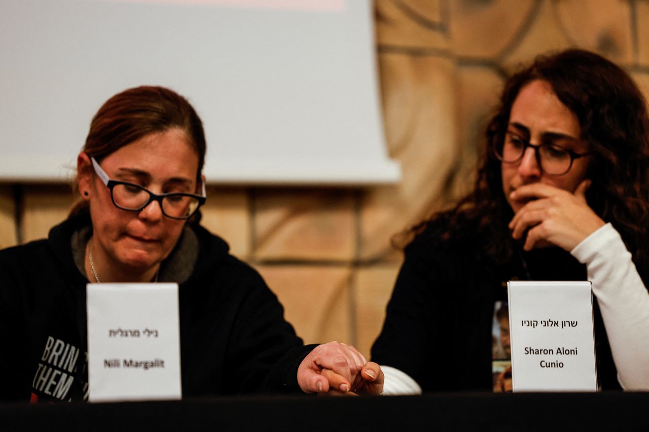 Released hostages Nili?Margalit, left,?and Sharon Aloni Cunio hold hands as they attend a press conference at the headquarters of the Hostages and Missing families forum in Tel Aviv, Israel, on February 7.