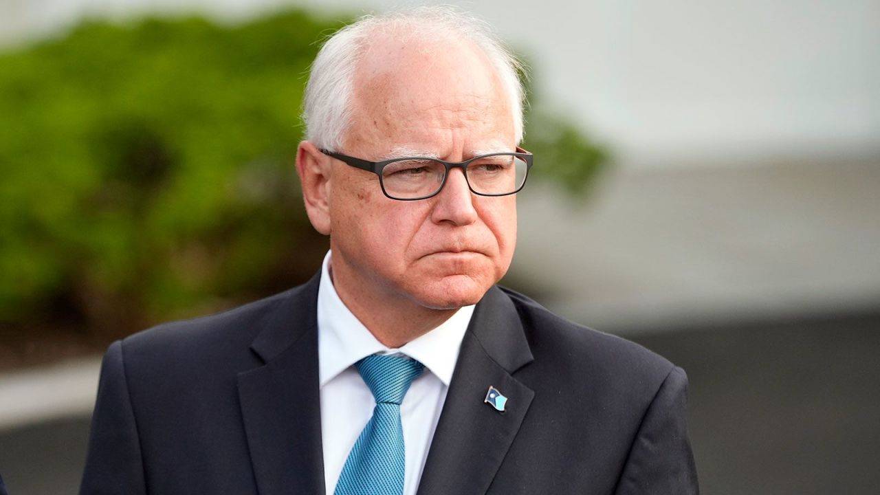 Minnesota Gov. Tim Walz listens as Maryland speaks to reporters after meeting with President Joe Biden, Wednesday, July 3, 2024, at the White House in Washington.