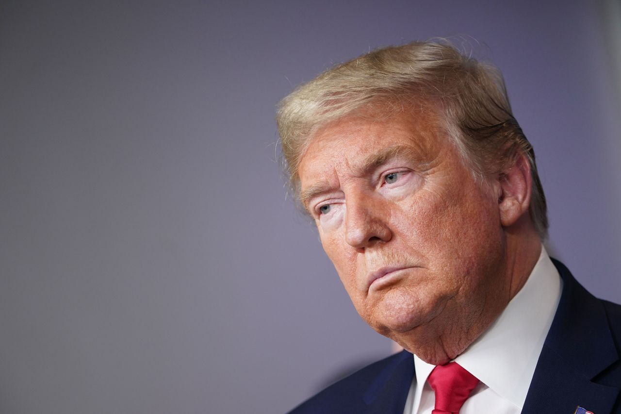 US President Donald Trump listens during the daily coronavirus briefing at the White House on March 24.