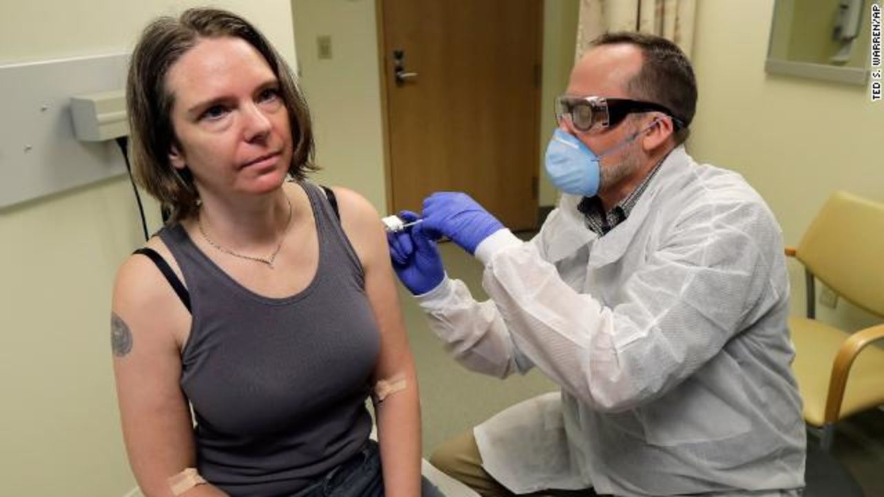 A pharmacist gives Jennifer Haller the first shot in the first-stage safety study clinical trial of a potential vaccine for Covid-19 on Monday, March 16, at the Kaiser Permanente Washington Health Research Institute in Seattle. 