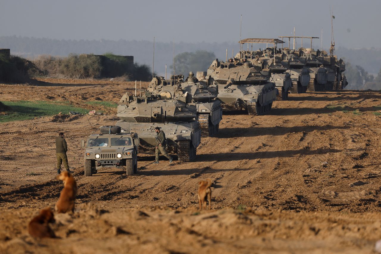 A convoy of Israeli military tanks and Armoured Personnel Carriers (APC) enter Israel on November 24.
