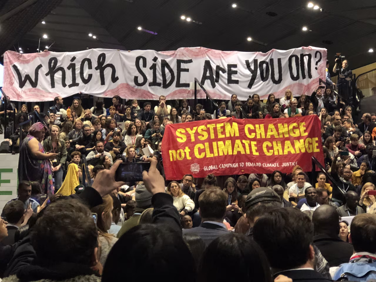 Protestors at COP24 chant: “Keep polluters out, let the people in.”