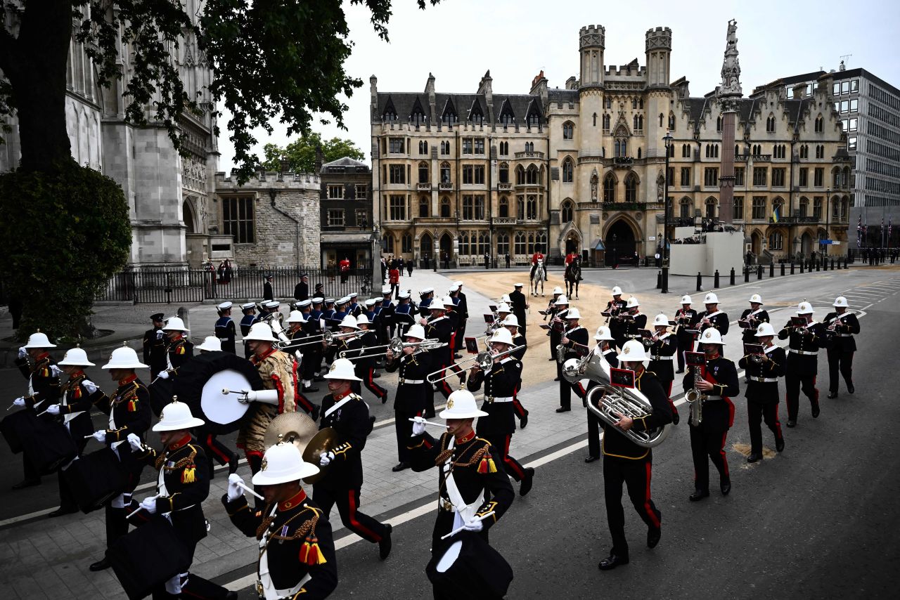 Troops march through London before the beginning of the funeral.