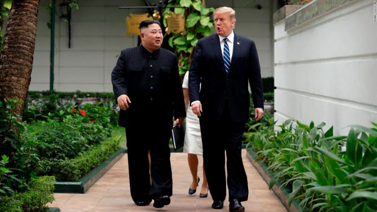 Kim and Trump go for a brief outdoor stroll at the beginning of their second day of meetings in Hanoi.