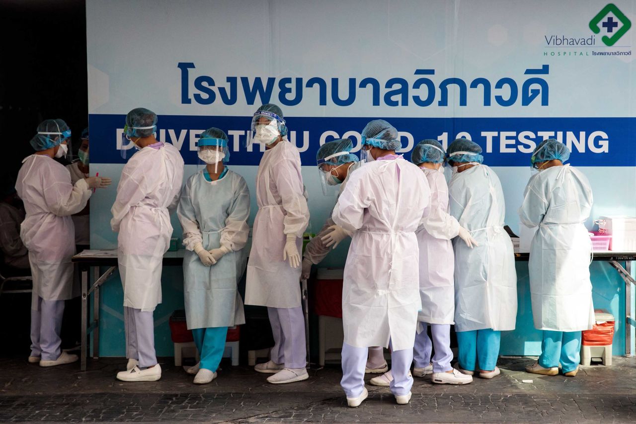 Medical staff prepare to test people for coronavirus at a drive-through testing center in Bangkok on March 25.