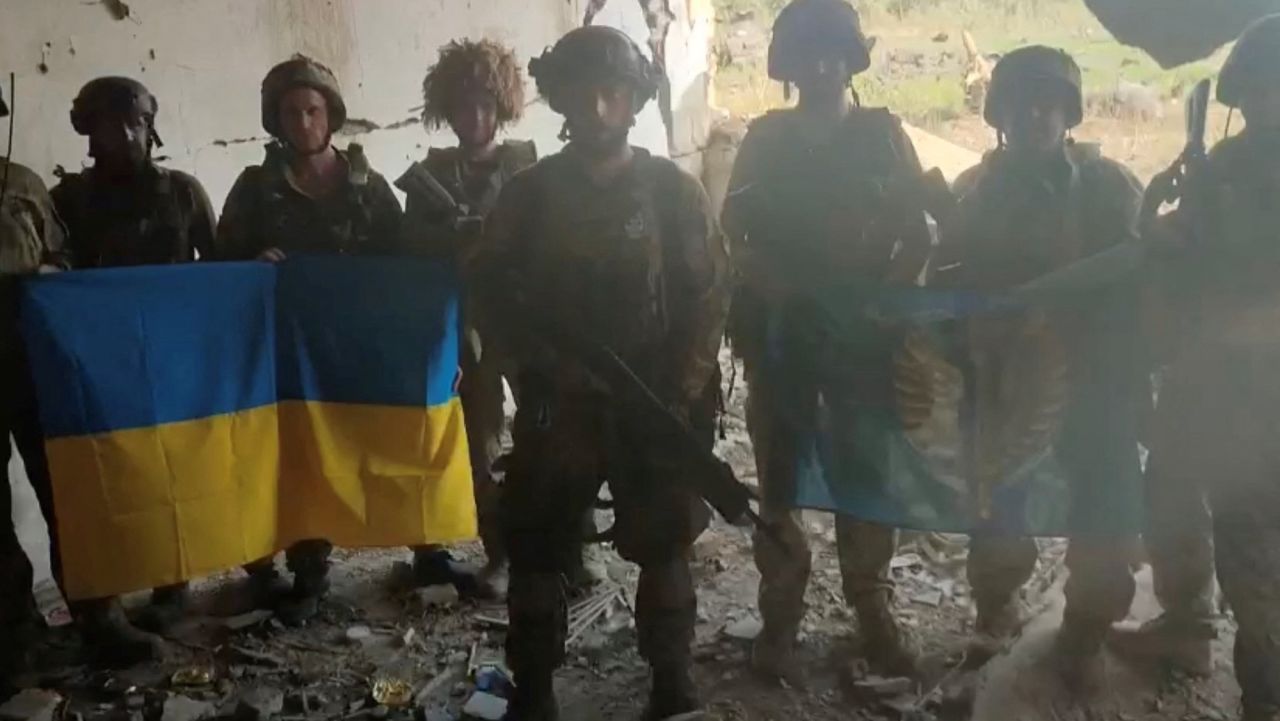 Ukrainian soldiers are seen in the Ukrainian village of?Staromaiorske, in this screen grab from video posted by Ukrainian President Volodymyr Zelensky on Thursday.