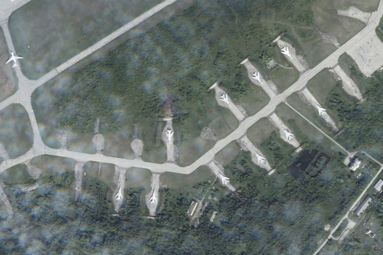 In this satellite photo from Planet Labs PBC, Tupolev Tu-22M bombers sit on the apron of the Soltsy air base in the Novgorod region of northwestern Russia on August 8.