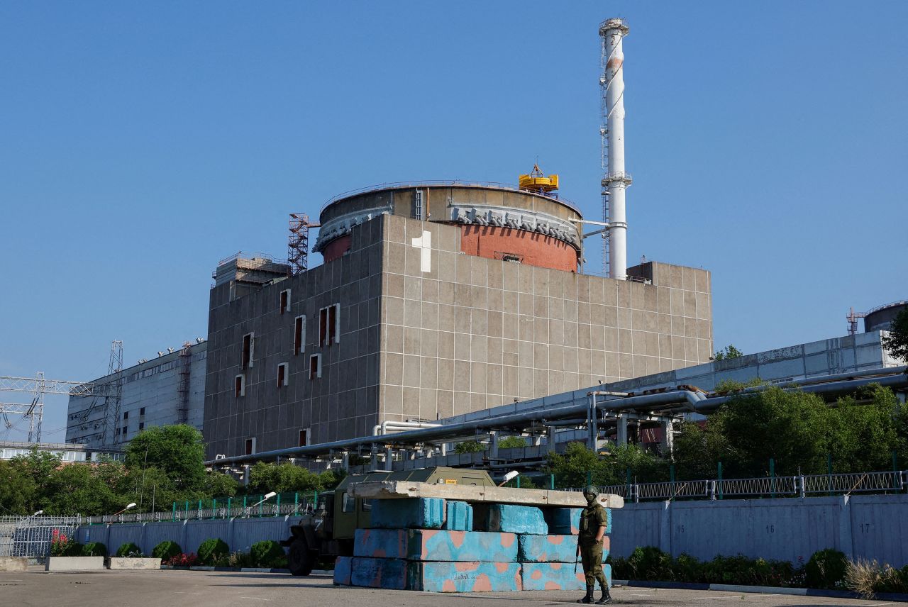 A Russian service member stands guard at a checkpoint near the Zaporizhzhia Nuclear Power Plant on June 15. 