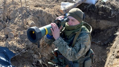 A Ukrainian soldier holds the FGM-148 Javelin, an American-made portable anti-tank missile at a checkpoint near Kharkiv on March 23.