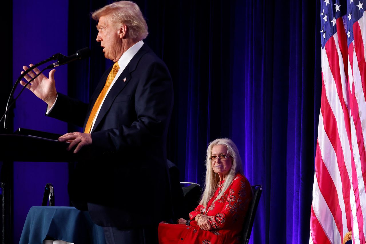 Miriam Adelson listens to Trump speak during a 