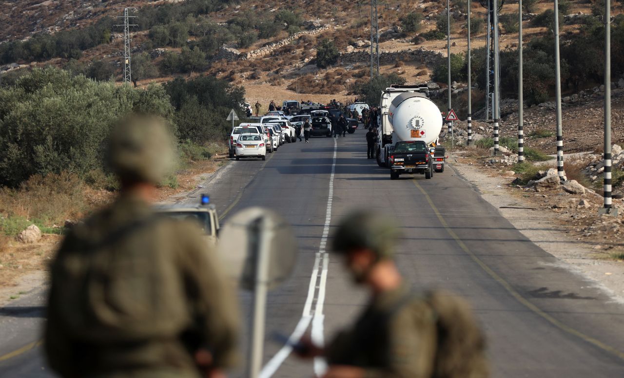 Israeli police search the area where a vehicle opened fire to an Israeli police car and killed 3 policemen at Tarqumiyah district of Hebron, West Bank on September 1.