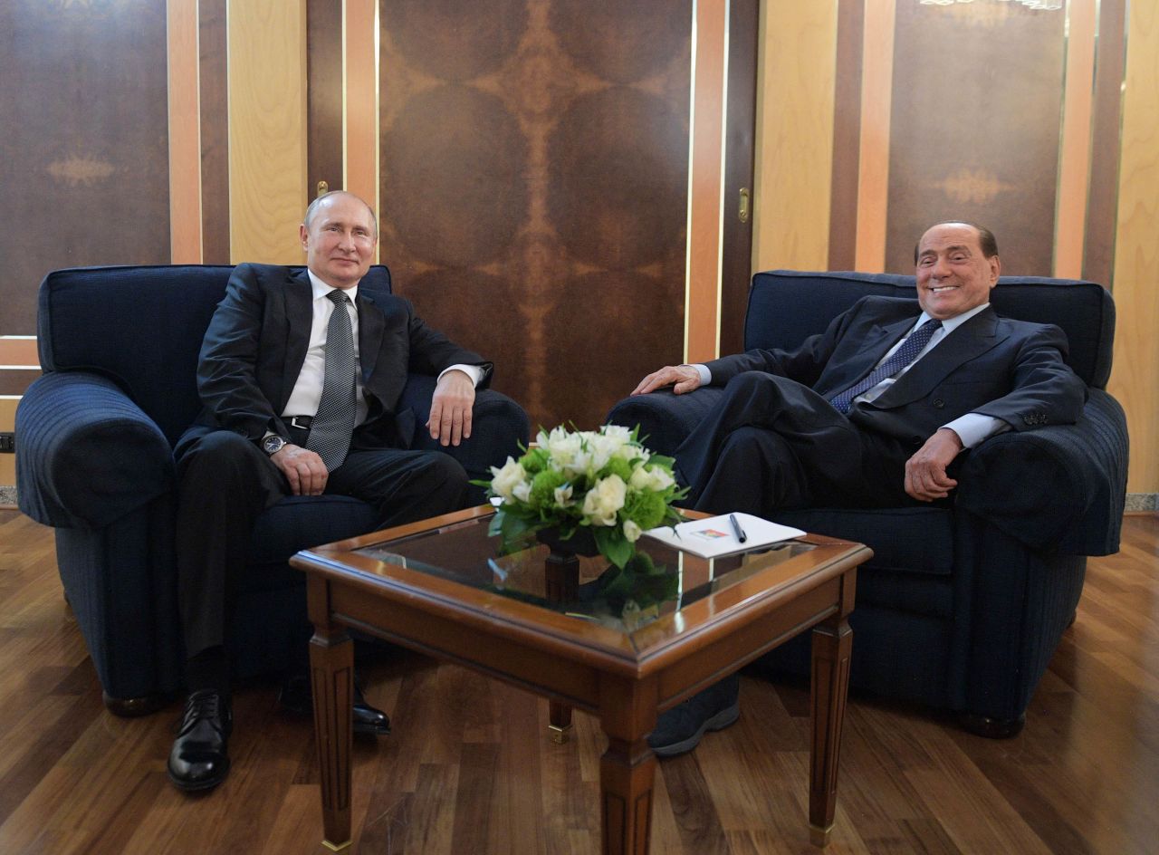 Russian President Vladimir Putin meets with Silvio Berlusconi at Fiumicino airport in Rome, on July 5, 2019.