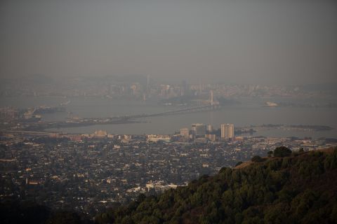 Smoke from wildfires fills the air over the San Francisco and Oakland skylines as seen from Berkeley, California, on Monday, September 28.