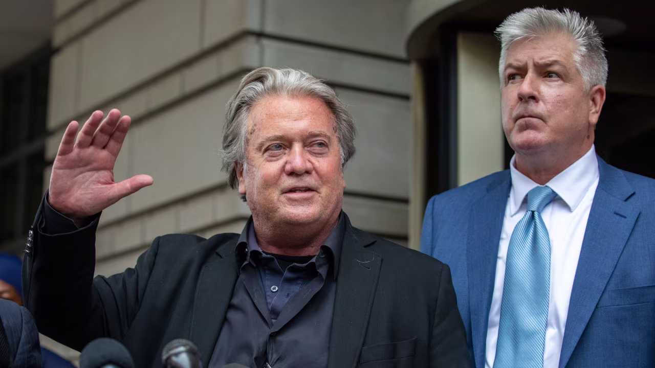 Steve Bannon, joined by lawyer Evan Corcoran, speaks to crowds outside of the courthouse on Monday.
