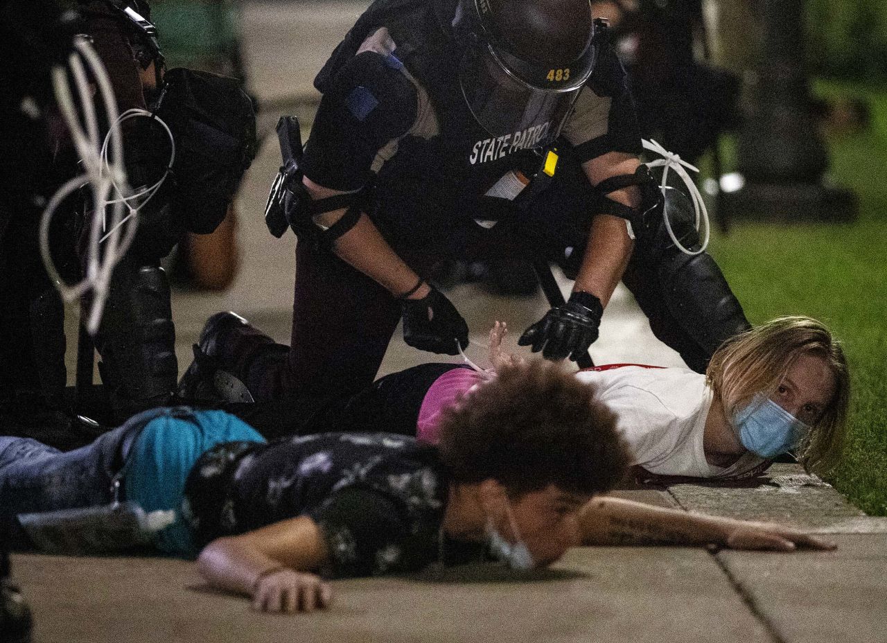 Protesters are handcuffed outside the State Capitol in St. Paul, Minnesota, on Monday, June 1. 