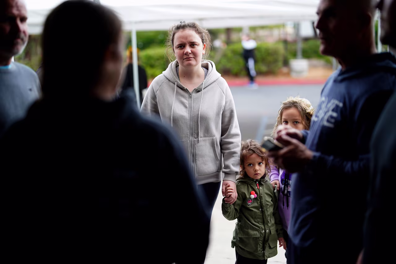 A Ukrainian family arrives at a shelter at the Christian church, Calvary San Diego, in Chula Vista, California, after crossing into the US from Tijuana, Mexico, on Friday, April 1. 