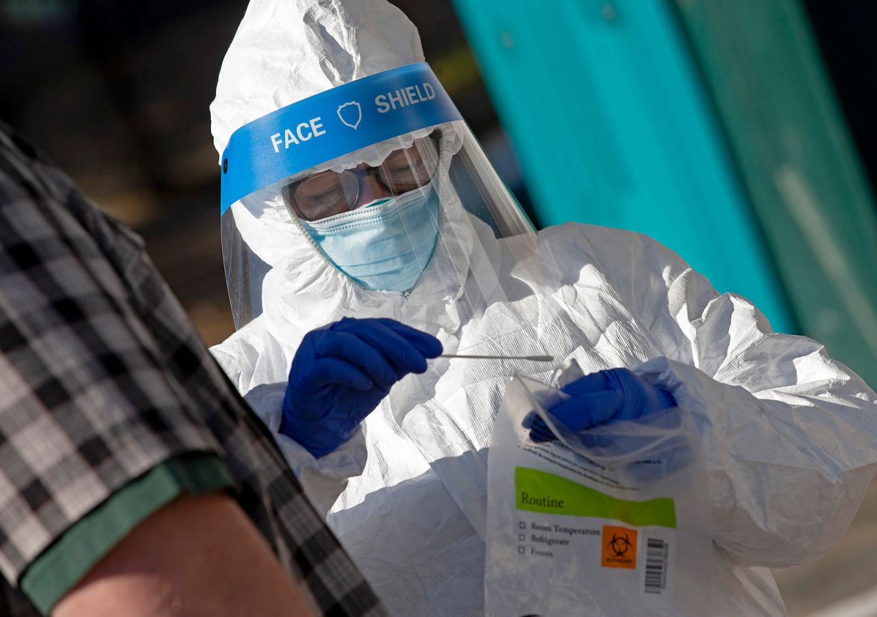 A health worker swabs a patient at a Covid-19 testing site in Roxbury, Massachusetts, on October 15.