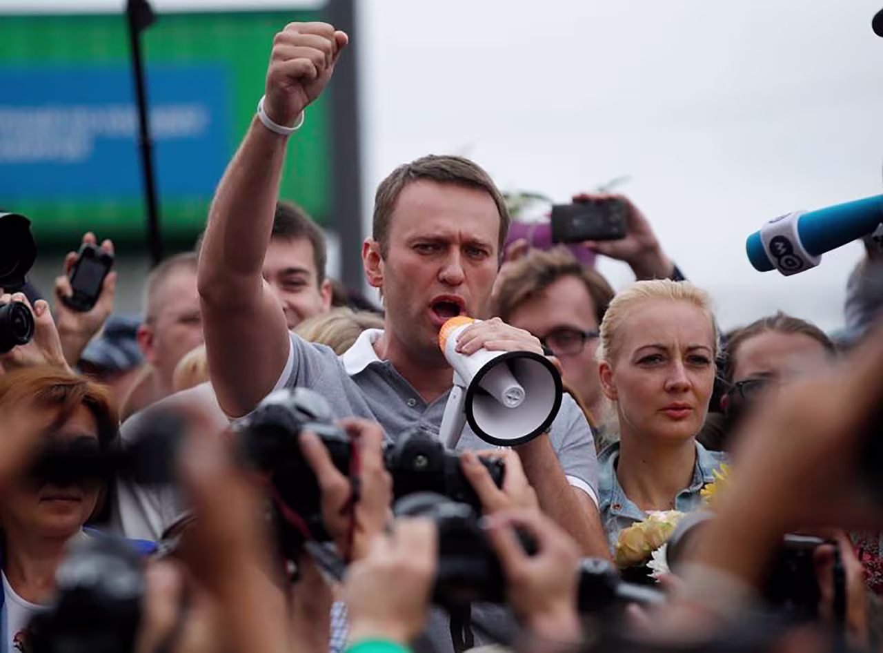 Alexei Navalny, center, addresses supporters and journalists in Moscow in 2013. 