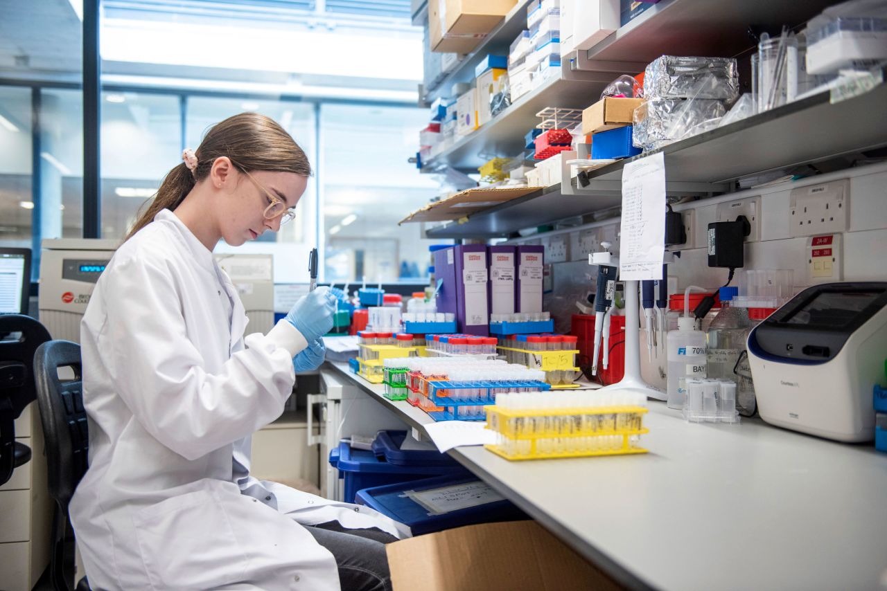 A researcher in a laboratory at the Jenner Institute in Oxford, England, works on the coronavirus vaccine developed by AstraZeneca and Oxford University.