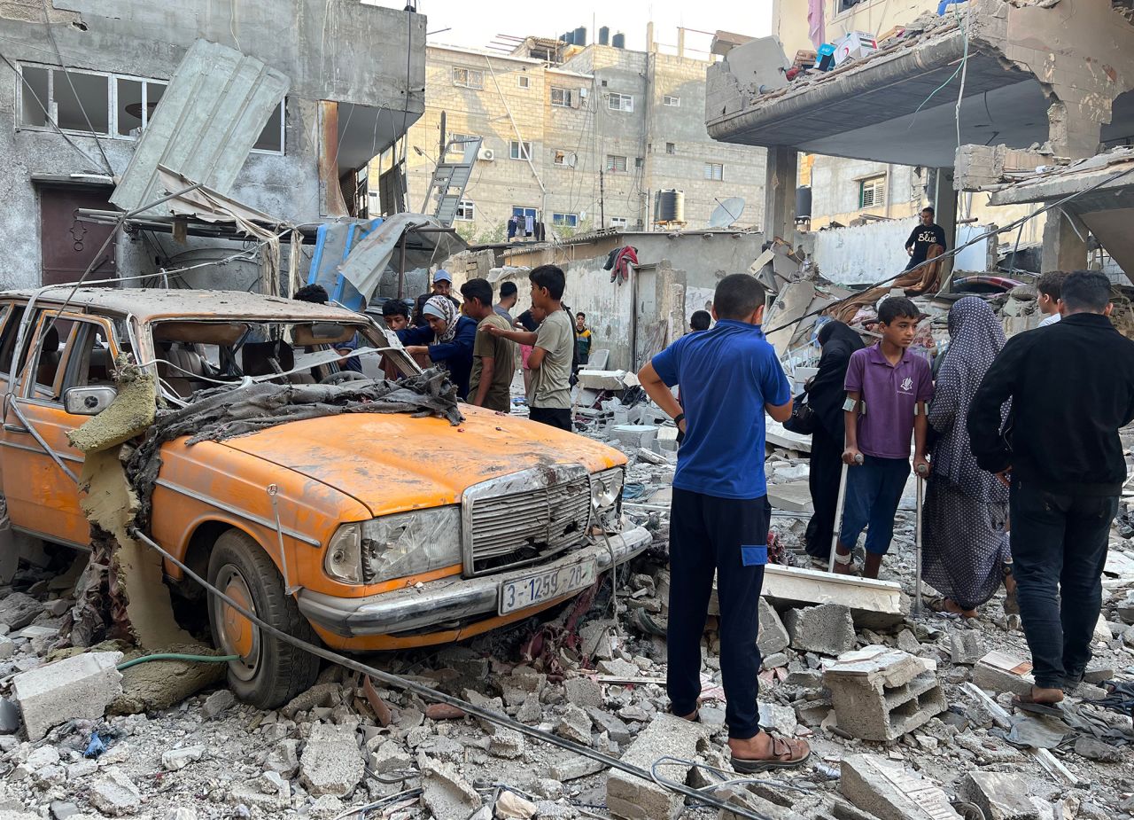 Palestinians inspect the site of a building that was hit by Israeli bombardment in Rafah, Gaza, on May 9.