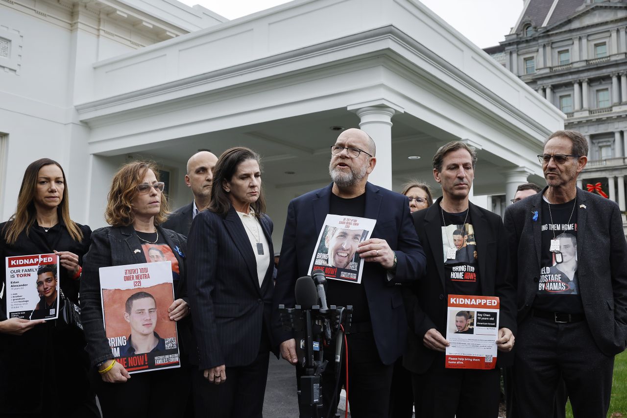 Family members of Americans who were taken hostage by Hamas during the attacks in Israel on October 7, including (L-R) Orna Neutra, Adi Alexander,  Liz Naftali, Jonathan Dekel-Chen, Ruby Chen, Ronen Neutra, and Yael Alexander, talk to reporters outside the West Wing of the White House on December 13 in Washington, DC. The families were invited to a private meeting with U.S. President Joe Biden and Secretary of State Antony Blinken.