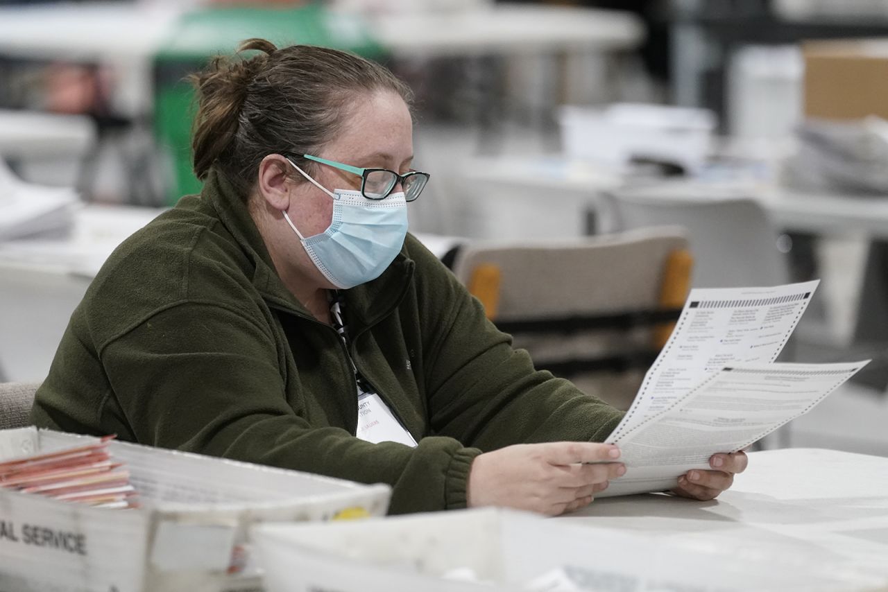 An officials works on ballots at the Gwinnett County Voter Registration and Elections Headquarters on Friday in Lawrenceville, Georgia. 