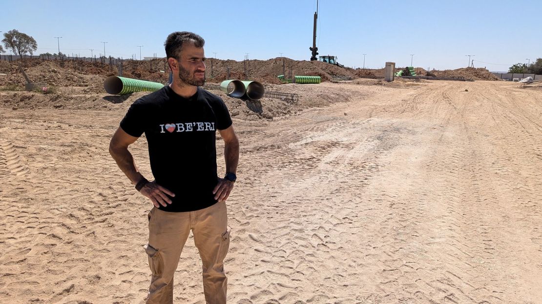 Yarden Tzemach, a farmer and surviving resident of kibbutz Be'eri, surveys the site where new construction is underway.